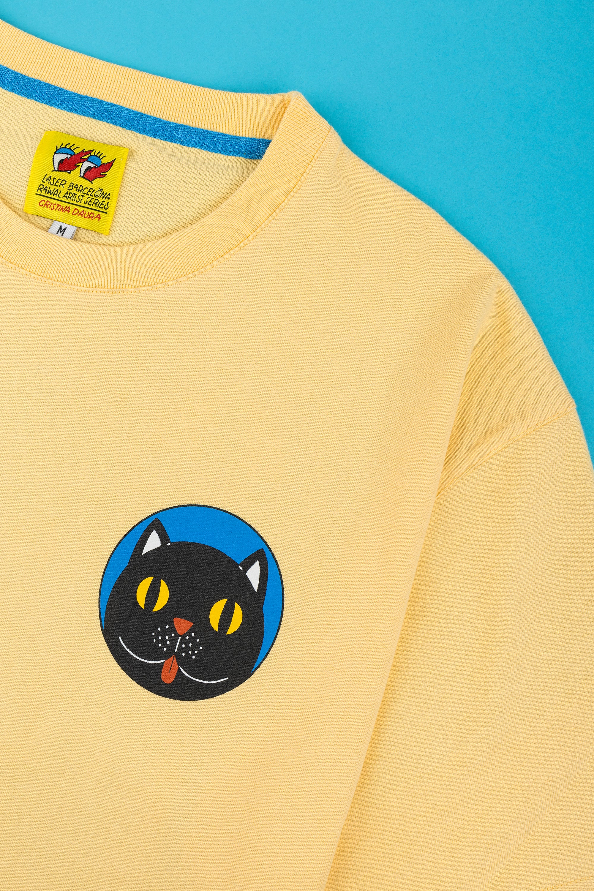 RAWAL ARTIST SERIES X CRISTINA DAURA TEE PASTEL YELLOW – LASER